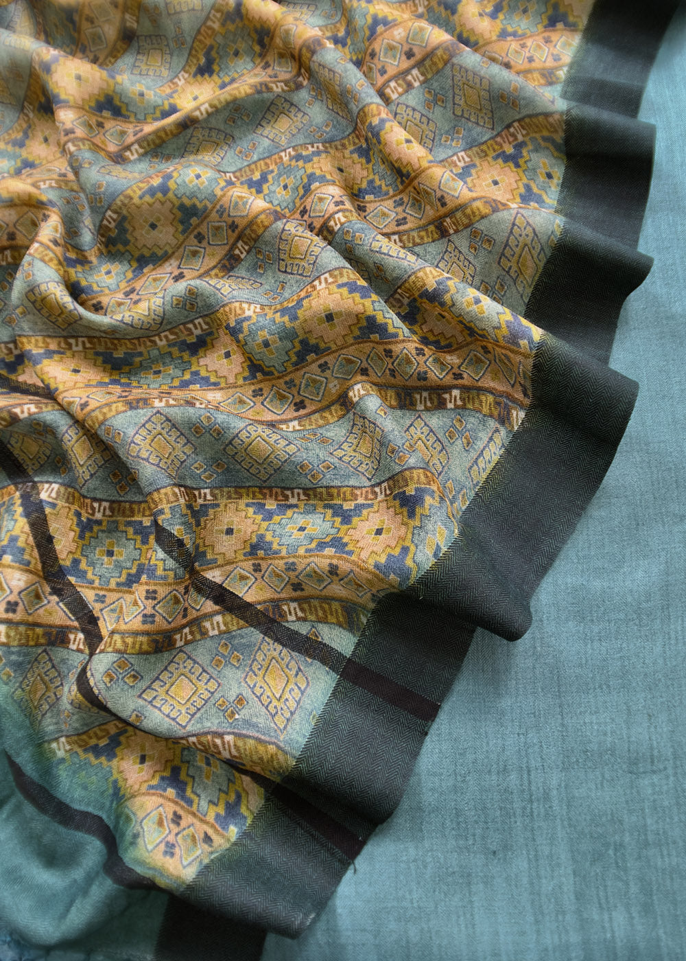 Close-up of the brocade fabric with a detailed design.