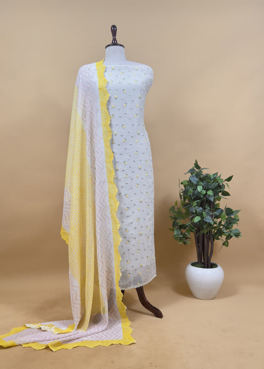 Grey With Yellow Embroidered Unstitched Mulmul Suit With Scalloped Border.