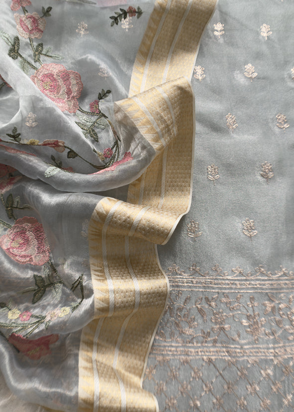 Luxe Powder Blue Handloom Tissue Silk Suit Adorned With Gold Pitta Work And Resham Embroidery