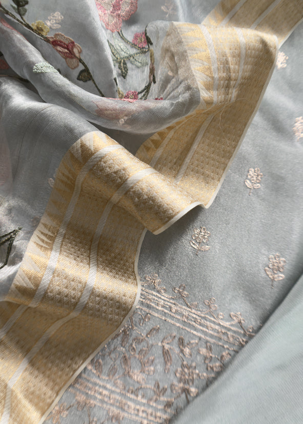 Luxe Powder Blue Handloom Tissue Silk Suit Adorned With Gold Pitta Work And Resham Embroidery