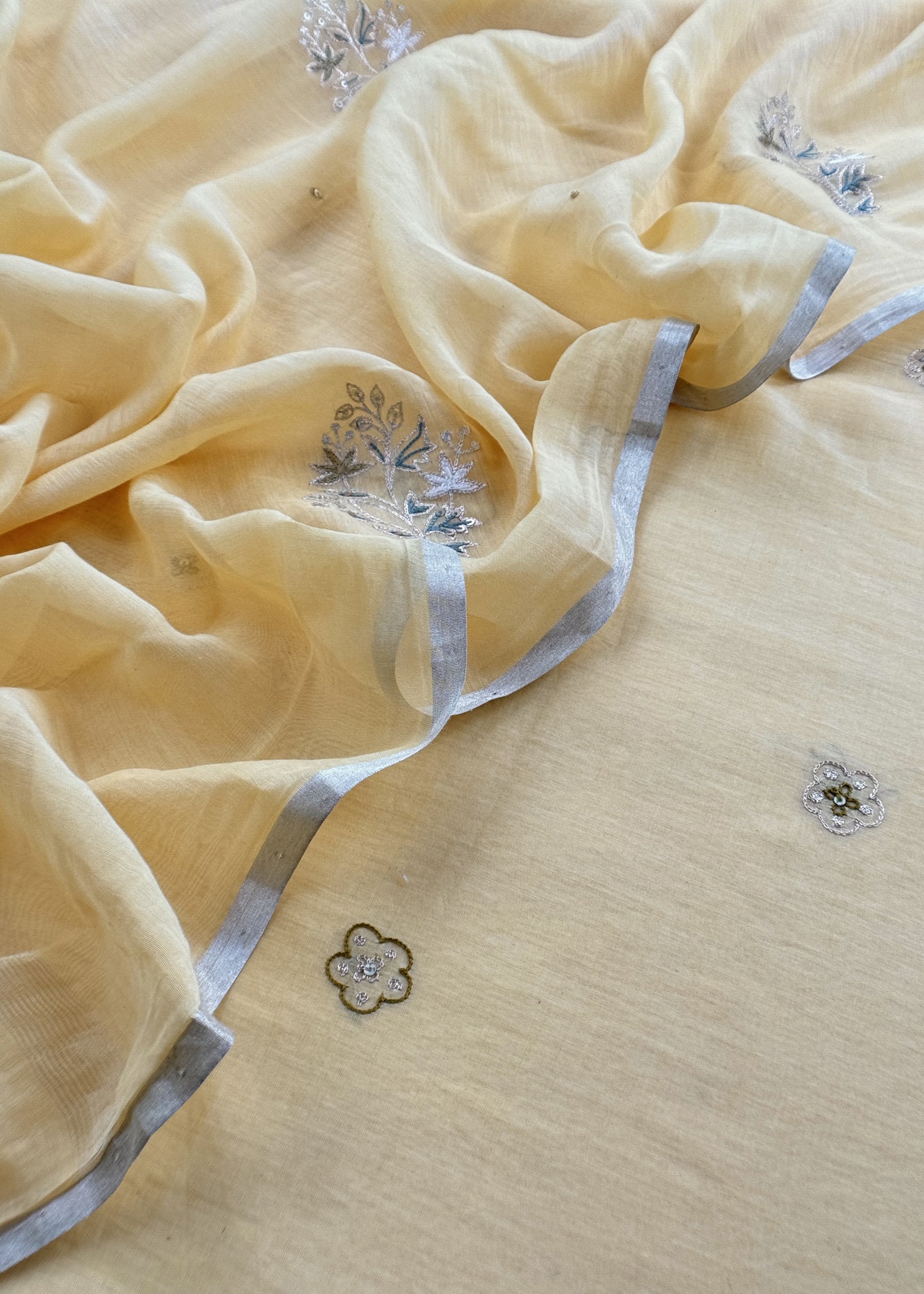 Light Yellow Mulmul Suit And Dupatta In Dori Work