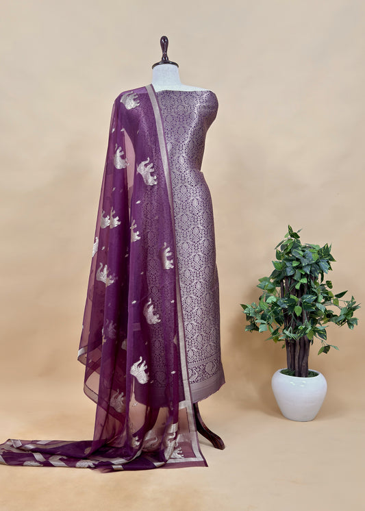 PurpleThe wedding wear three-piece suit has brocade kurta and organza Dupatta