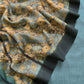 Close-up of the brocade fabric with a detailed design.