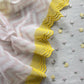Grey With Yellow Embroidered Unstitched Mulmul Suit With Scalloped Border.