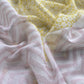 Grey With Yellow Embroidered Unstitched Mulmul Suit With Scalloped Border.