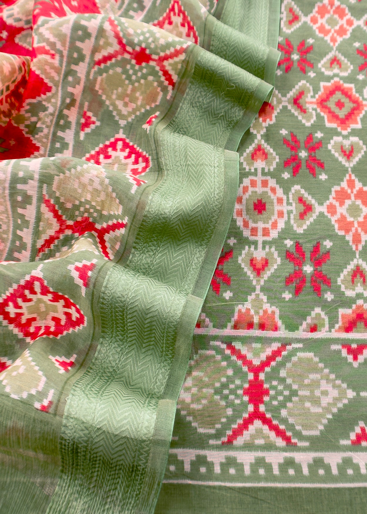 Green With Red Handloom Patola Unstitched Suit In Mulmul
