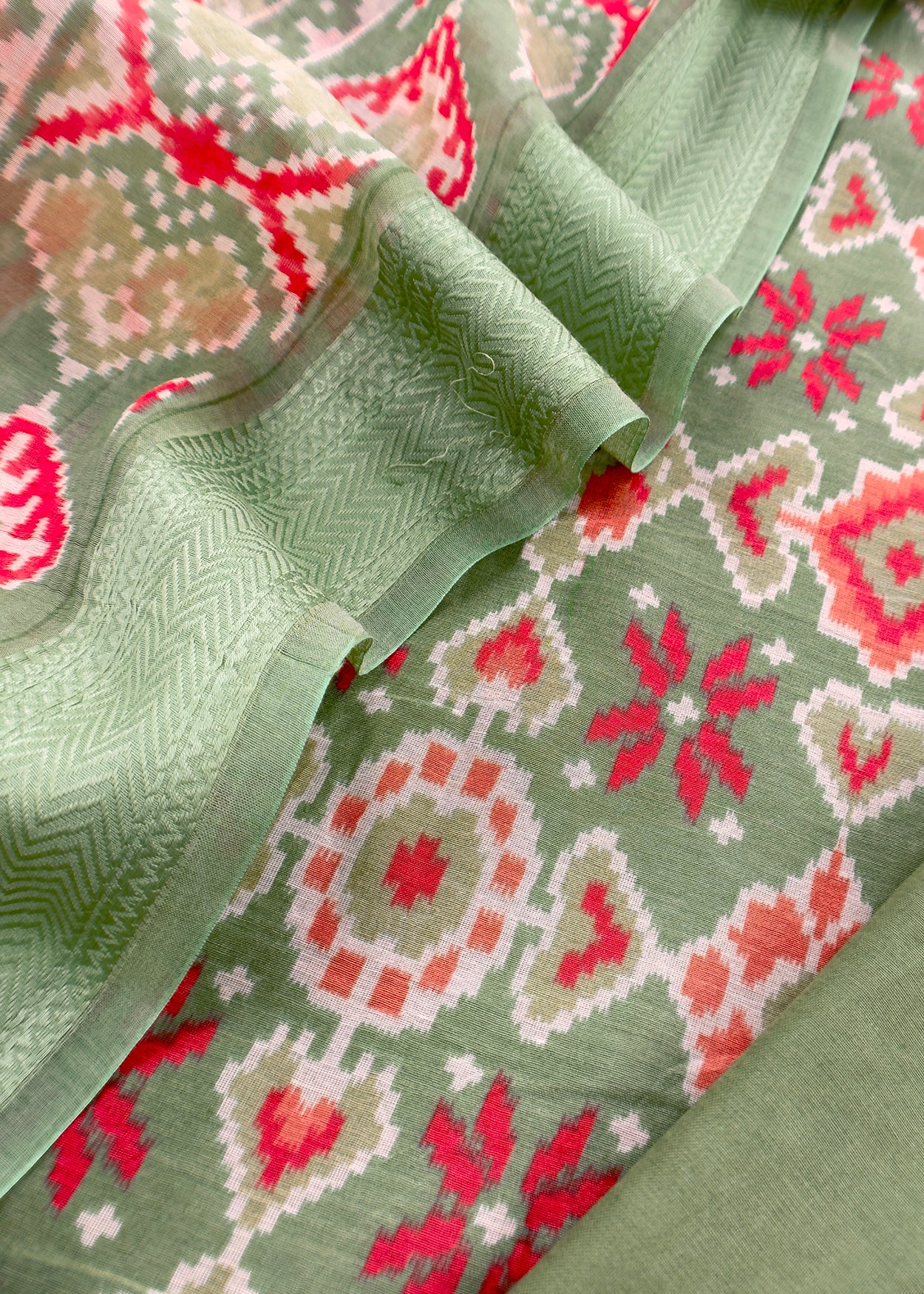 Green With Red Handloom Patola Unstitched Suit In Mulmul