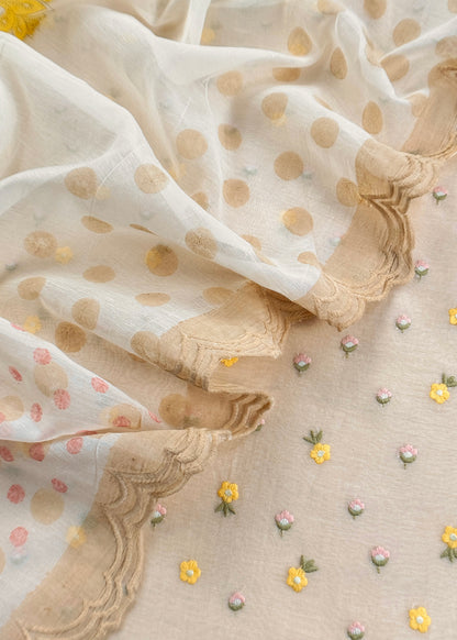 White With Yellow Embroidered Unstitched Mulmul Suit With Scalloped Border.