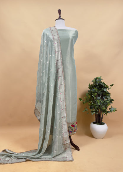 Luxe Basil Green Handloom Self Tissue Silk Suit Fabric With Paithani Weaving And Jhalar Gota Laces